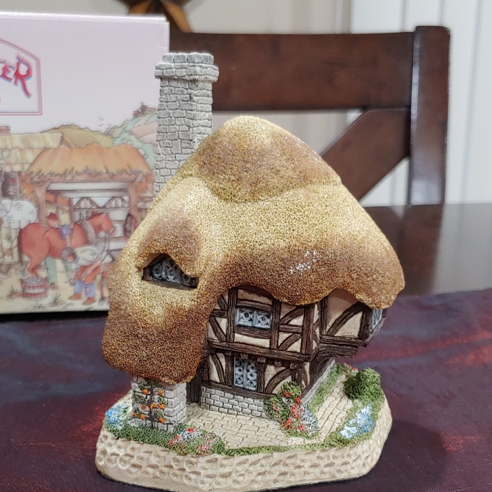 Charming Pudding Cottage Figurine with Thatched Roof